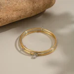 Doyours – Bracciale rigido multistrato bicolore in acciaio inox placcato oro 18K con pendente zircone