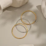 Doyours – Bracciale rigido multistrato bicolore in acciaio inox placcato oro 18K con pendente zircone - immagine 5