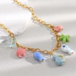 Doyours – Collana con ciondoli marini in ceramica (pesce, stella marina, tartaruga, conchiglia) in acciaio inox regolabile - immagine 2