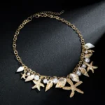 Doyours – Collana girocollo estiva multielemento con conchiglia, stella marina e perle - immagine 5