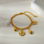 Doyours – Bracciale multifascino in acciaio inox placcato oro 18K con cuore, farfalla, girasole e occhio - immagine 5