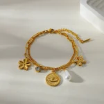 Doyours – Bracciale multifascino in acciaio inox placcato oro 18K con cuore, farfalla, girasole e occhio - immagine 4