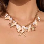 Doyours – Collana girocollo estiva multielemento con conchiglia, stella marina e perle