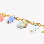 Doyours – Collana con ciondoli marini in ceramica (pesce, stella marina, tartaruga, conchiglia) in acciaio inox regolabile - immagine 5