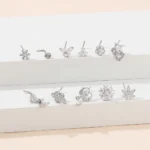 Set 11 anelli naso L in acciaio con zirconi cuore e farfalla - immagine 4