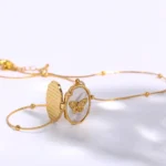 Collana vintage con ciondolo farfalla e medaglione apribile - immagine 5