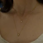 Collana dorata in acciaio con ciondolo a perline - immagine 3