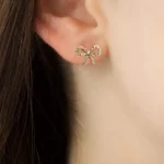 Orecchini mini fiocco in zircone CZ color oro - immagine 2