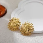 Orecchini vintage simbolo celeste in acciaio dorato 18K