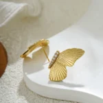 Orecchini a bottone farfalla in acciaio inox dorato - immagine 5