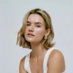 Orecchini a bottone ovali vintage in acciaio inox dorato - immagine 2