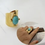 Anello donna acciaio dorato con pietra naturale rotonda - immagine 2
