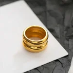 Anello donna a cupola doppia in acciaio inox dorato - immagine 3