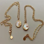 Collana vintage sole e luna con pendente a conchiglia - immagine 6