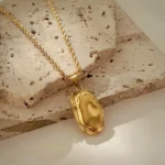 Collana oro con ciondolo irregolare e catena intrecciata - immagine 5